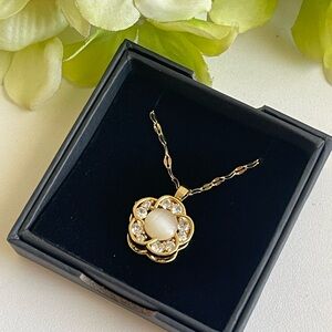 Elegant gold opal and crystal spinning pendant necklace